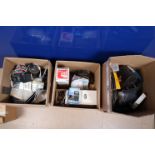 Three Boxes of Camera Related Accessories, including Omega, Nikkor steel developing tanks, other