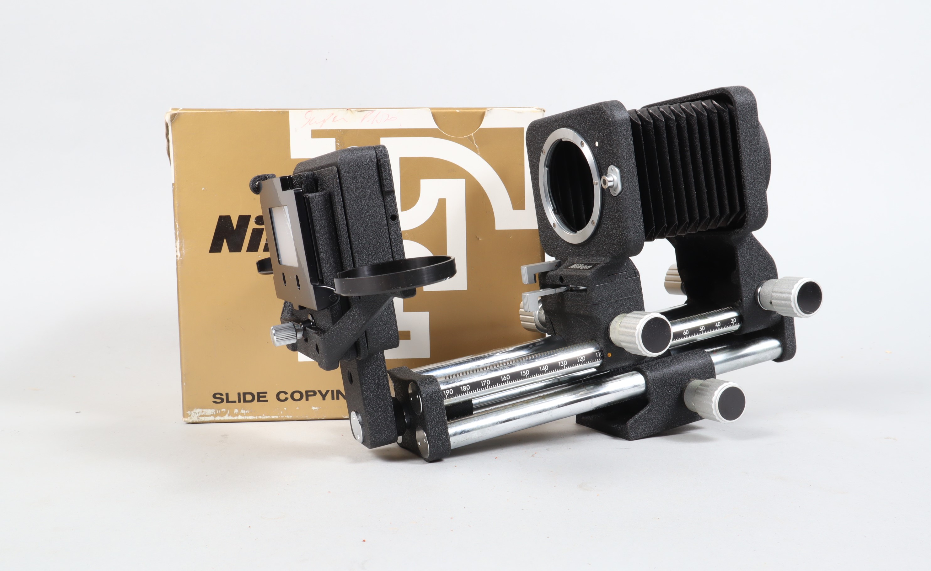 A Nikon PB 4 Bellows Focusing Attachment, unboxed, body G-VG, bellows G-VG, with Nikon PS-4 slide