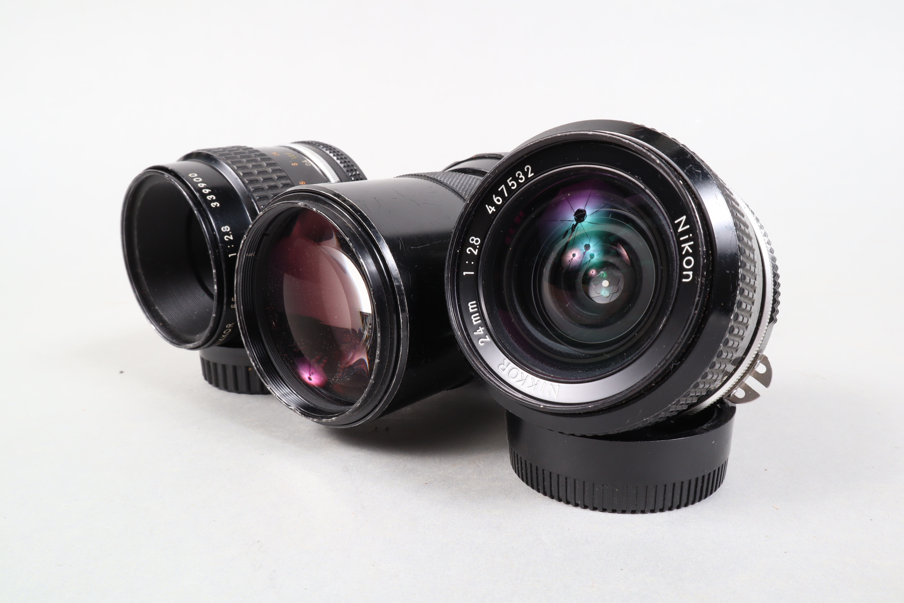 A Group of Nikon Ai Lenses, a Nikkor 24mm f/2.8 lens, barrel G, some wear, brassing to mount,