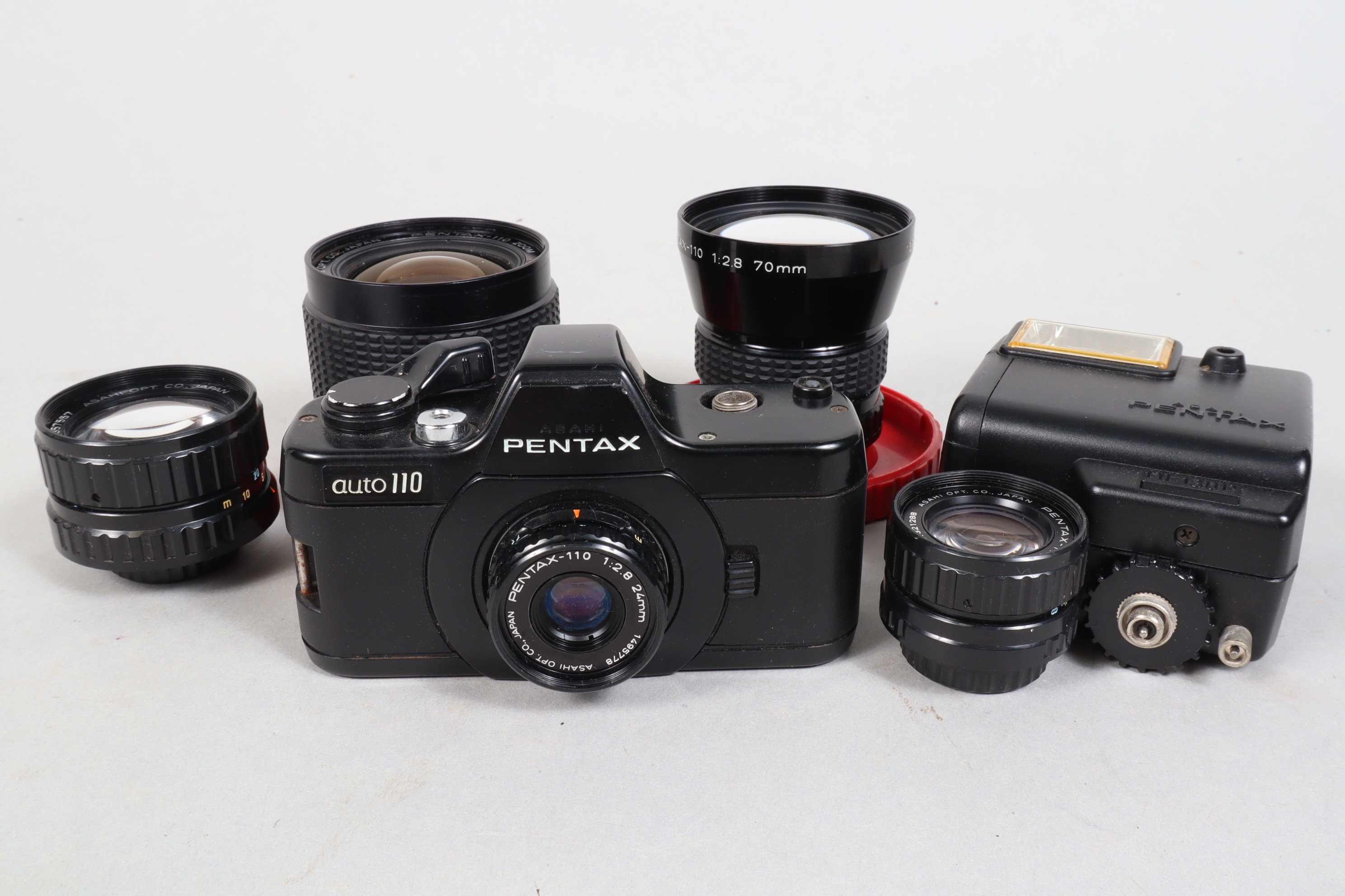 Asahi Pentax Auto 110 SLR Camera and Lenses, comprising an Auto 110 body, a Pentax-110 24mm lens,