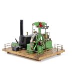 A complete Stuart Turner spirit-fired operating Steam Beam Engine, mounted on a wooden plinth with a