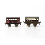 Early Hornby 0 Gauge Constructional Coaches, both with separately-fitted axleguard bases, thick