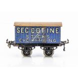 An uncommon Hornby 0 Gauge OAG Constructional 'Seccotine' Van, on rare base with separately-