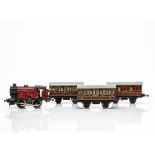 A Hornby 0 Gauge clockwork M3 0-4-0T Locomotive and 3 Coaches, all in lithographed LMS crimson,