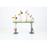 A Hornby 0 Gauge No 2 (Distant) Signal Gantry, all four dolls having yellow 'distant' arms, the