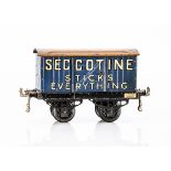An early Hornby 0 Gauge 'Seccotine' Private Owner Van, on black 'OAG' base with large drop-link
