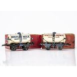 Hornby 0 Gauge Milk 'Super-Tankers', both on T3 bases with 'gagged' truss rods, United Dairies on