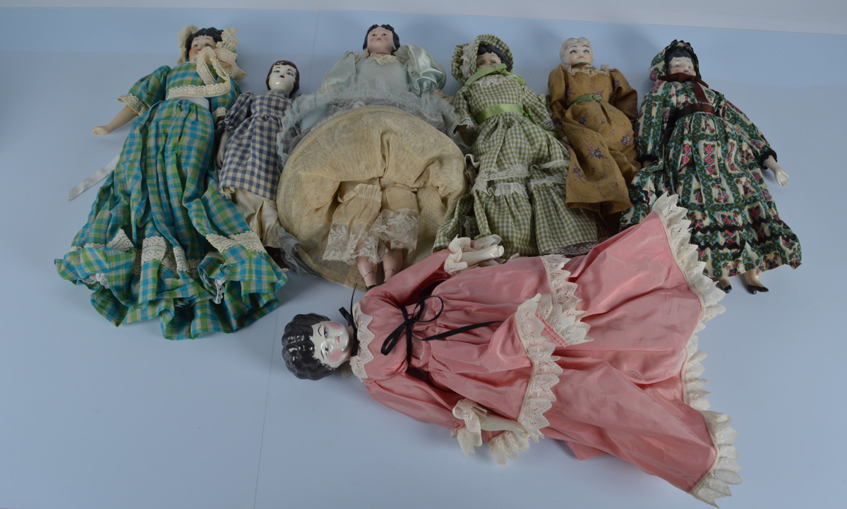 Five reproduction china shoulder head dolls, stuffed bodies, 19 inch (48cm) largest, and bisque