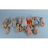 A collection of plastic head baby dolls, by various makers including Rosebud, some composite head