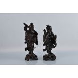 Two Chinese hardwood figures, carved wood in the form of men. 37cm and 34cm tall