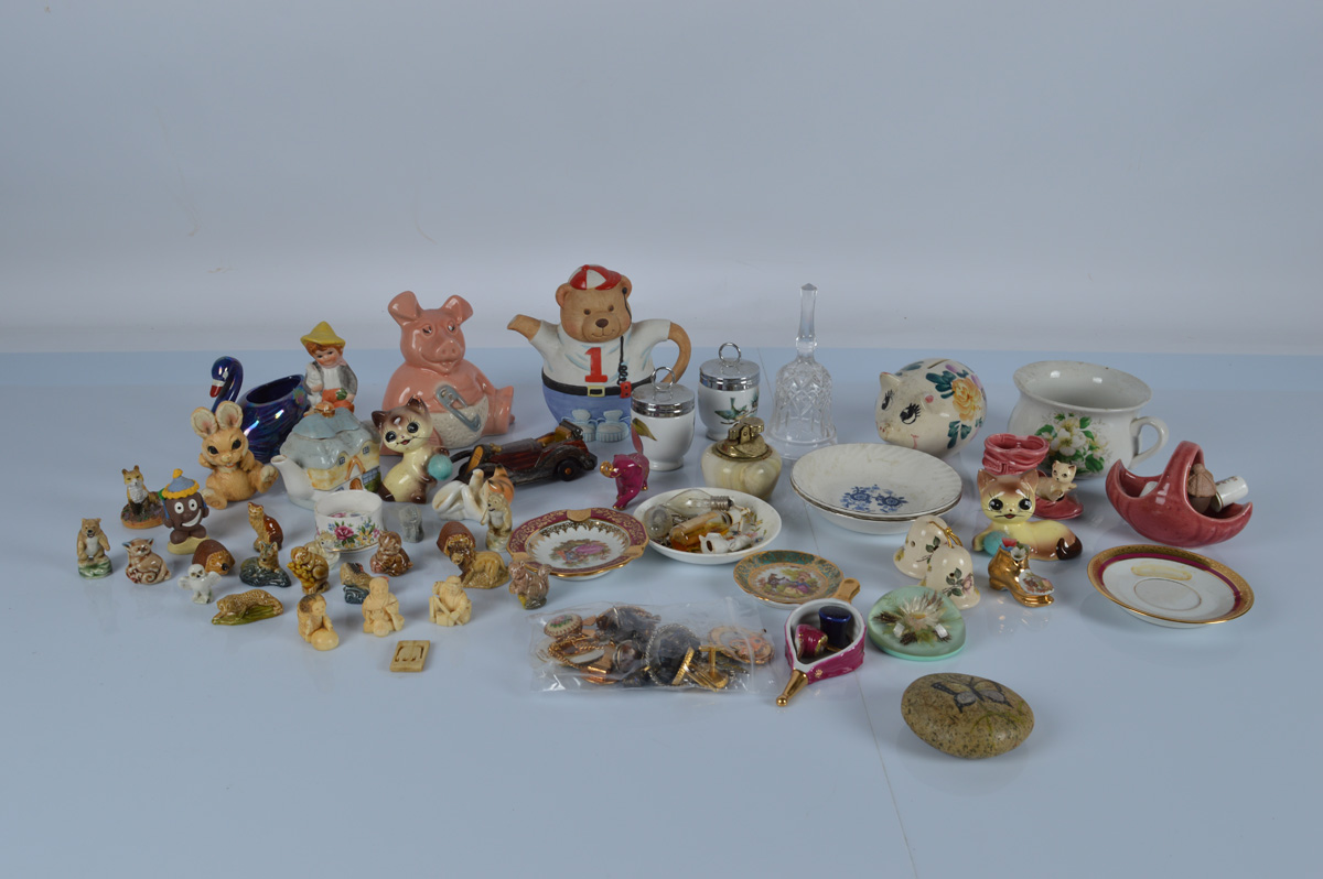 A mixed lot of assorted ceramics and ornaments, including a ivory netsukes, a Natwest Pig, costume