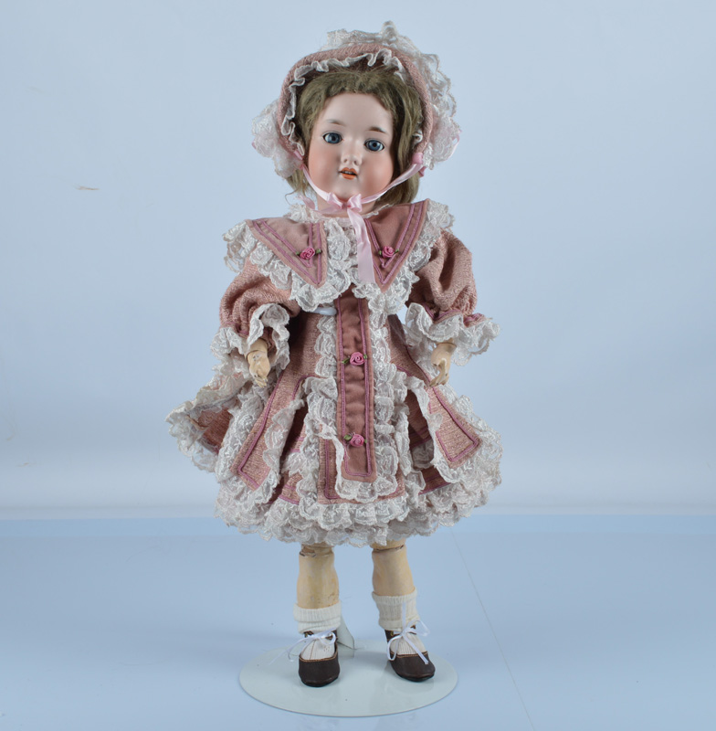 An Armand Marseille 390n child doll, with blue sleeping eyes, light brown mohair wig, jointed