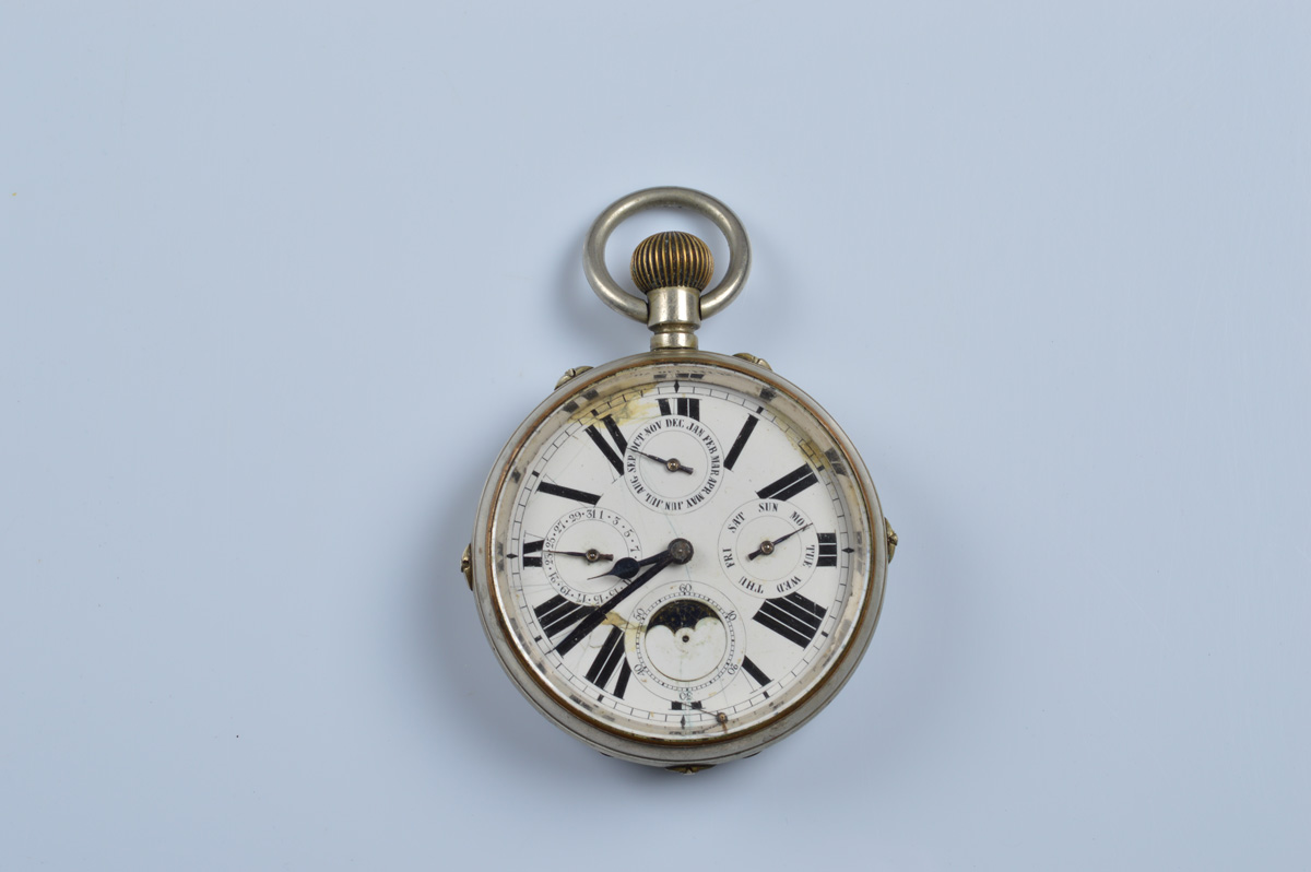 An early 20th century open faced fob watch, with moonphase triple calendar, white enamel face, roman