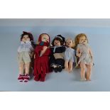 Five hard plastic child dolls, all with weighted eyes, one with squeak, one in crimson red skirt and