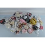 A quantity of doll accessories, including tiaras, bonnets, hats etc