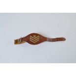 A British Army Sergeant Major's arm/wrist band, leather strap, chromed buckle, brass stripes