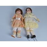 An SFBJ 60 child doll, with dark sleeping eyes, replaced brown wig, jointed papier mache body and