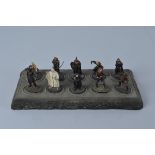 A set of ten Lord of The Rings metal figures, with resin display stand