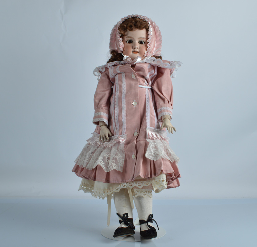 An Armand Marseille 1894 DEP child doll, with brown sleeping eyes, replaced brown wig, jointed