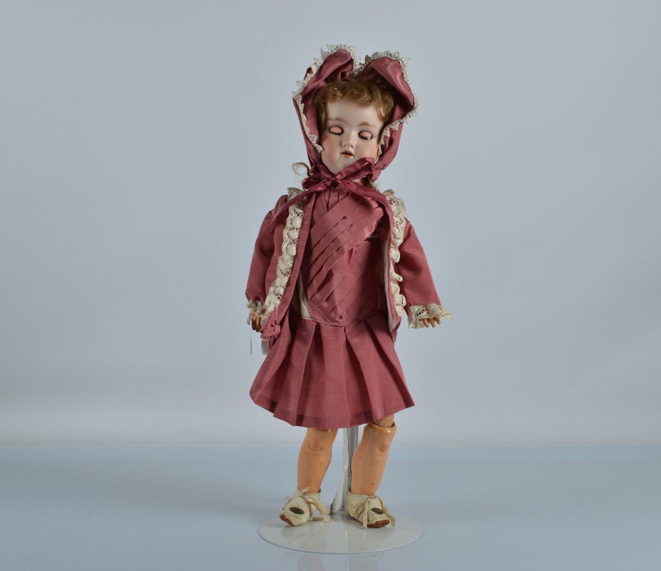 An Armand Marseille 390 child doll, with blue sleeping eyes, brown mohair wig, jointed composition