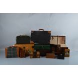 A collection of dolls travel accessories, including trunks, tartan and leather suitcases,