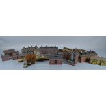 A large quantity of card kit built railway layout buildings, including houses, platforms, station