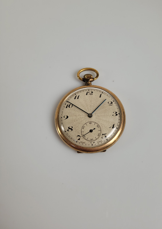 An Art Deco rolled gold open faced gentleman's fob watch, with Swiss movement, engine turned