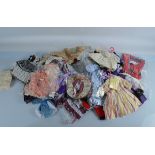 A large quantity of dolls accessories and clothing, including four various head dresses, read and