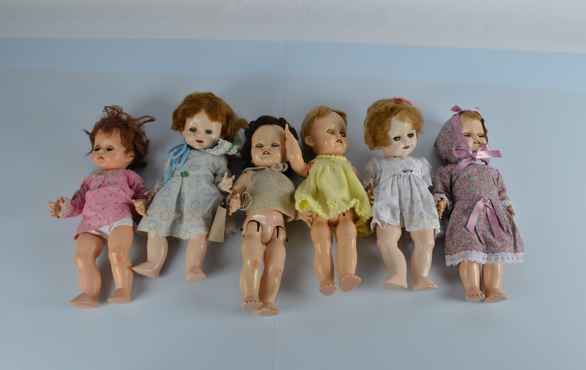 Three Pedigree baby dolls, 15 inch (38cm) high and three Pedigree walking child dolls, 16 inch (