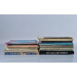 A collection of assorted sheet music books, including Motown, The Police, The Beatles, Elton John,