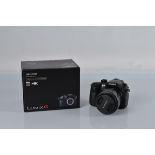 Panasonic Lumix DMC-GH4 4K digital camera, with a Lumix G Vario 1:3.5-5.6 /14-140 lens, with box.