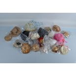 A large quantity of dolls accessories and hats, including fur muff, straw bonnets and other items