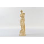 A late Grand Tour alabaster carving of Venus de Milo, on a socle circular base, 36cm high