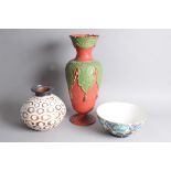 A large early 20th century red and green ceramic vase, 53cm, together with a large pottery bowl, and