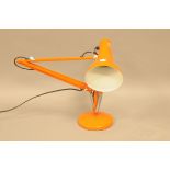 A vintage orange angle poise lamp from the Angle Poise Lamp co.