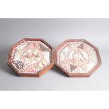 A pair of Victorian or Edwardian sailor's Valentines, the octagonal frames, once joined by hinges,