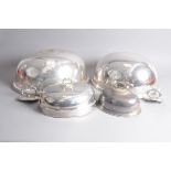 Two large Victorian silver plated meat covers, one by Elkington, dented, and with family crest,