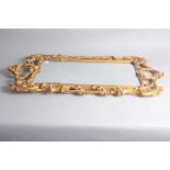 A first half 20th century Rococo style gilt framed mirror, 103cm high