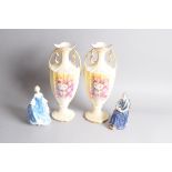 Two Royal Doulton porcelain figures, The Cup of Tea, and, Hilary, together with a pair of