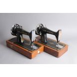 Two vintage Singer hand crank boxed sewing machines