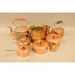 Three vintage copper kettles and more, also three graduated saucepans with lids, a jug, a plant pot,
