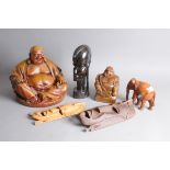 Six Chinese and African decorative items, including a large resin seated Bhuddha, two masks and more