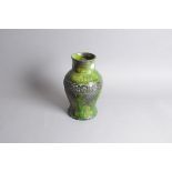 An Art Deco period European pottery vase, in green glaze with raised design to shoulder, 30cm