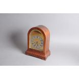 A mid 20th century mantle clock, domed wooden case with brass and steel dial, 35.5cm