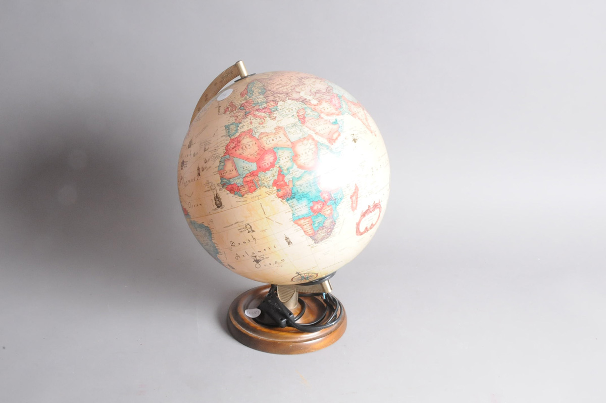 A modern World Globe lamp, the light up globe on turned wooden base, 40cm