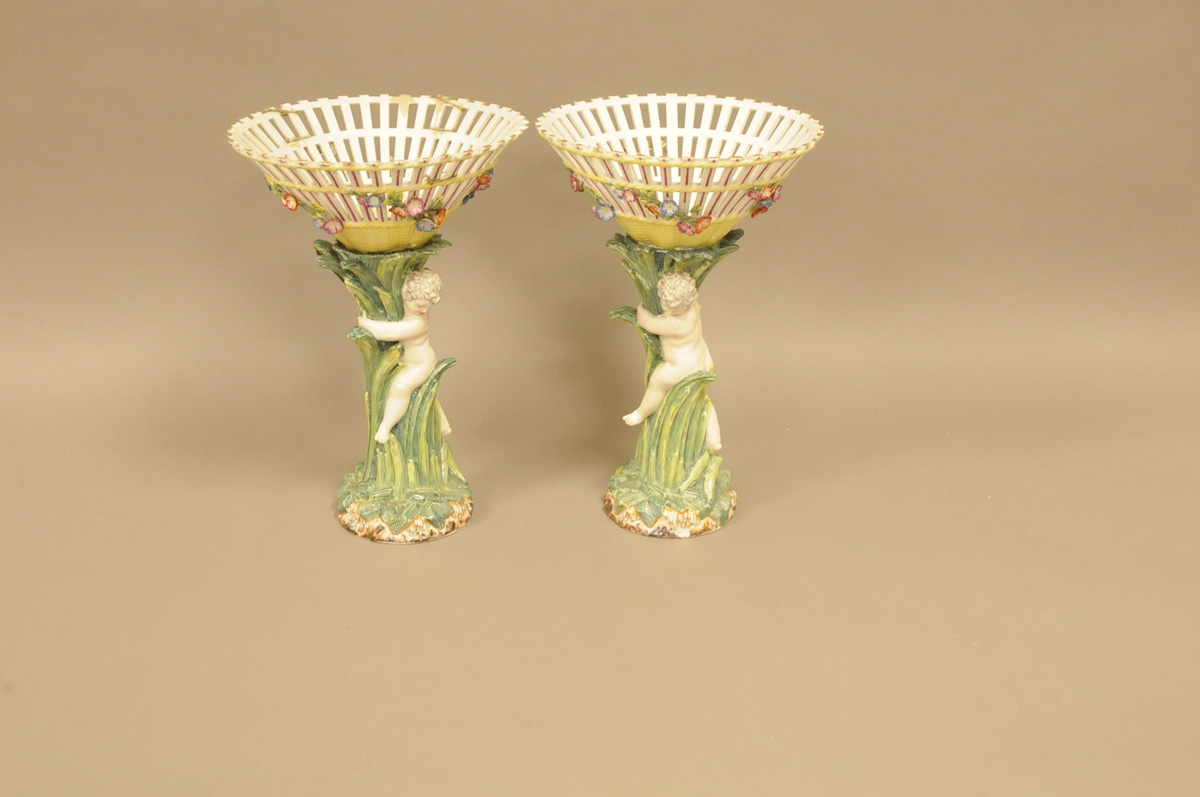 A pair of damaged 20th century Berlin porcelain centrepieces, 31cm, one heavily repaired, the
