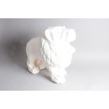 An early 20th century carved wooden white painted figure of a lion, 50cm, stood roaring, some