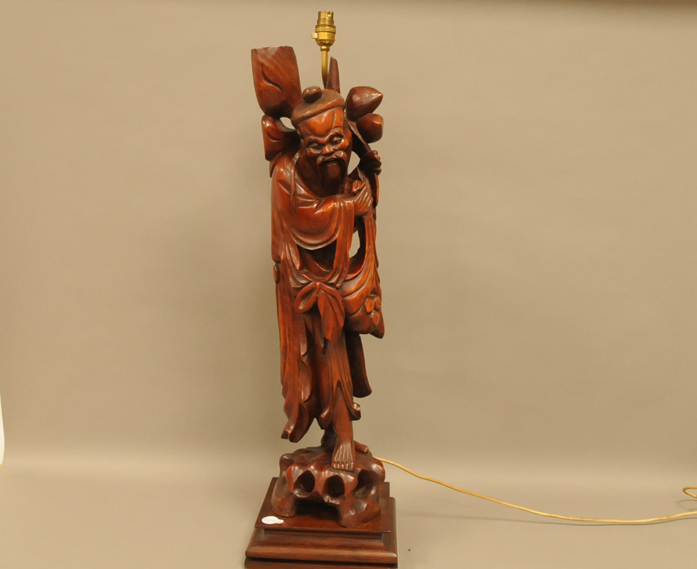 A mid 20th century Chinese wooden carved figural lamp base, 84cm high, the figure of a man, probably