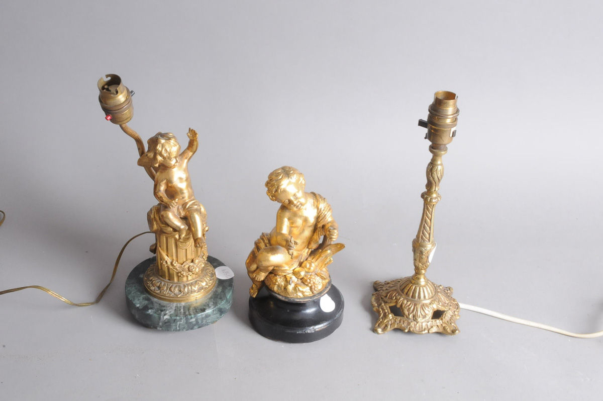 An early 20th century gilt metal and marble cherub on column lamp base, AF, 30cm, together with a