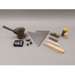 A small group of collectables and weights, to include a brass pestle and mortar, height 8cm (